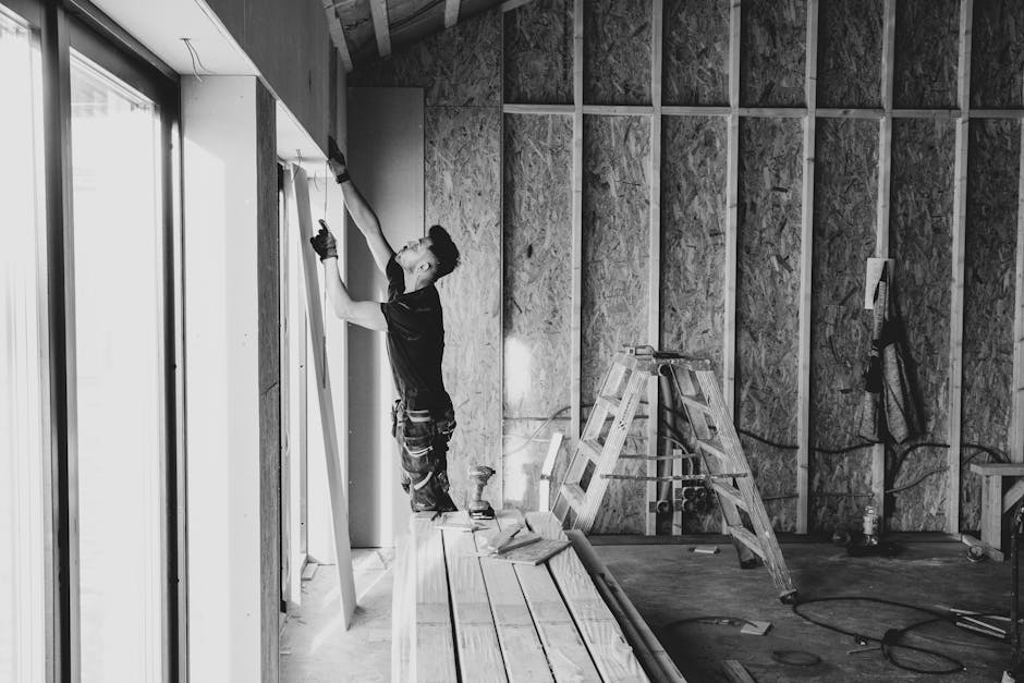 Window installation contractor working on a home